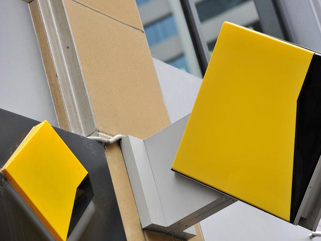 A file image of Commonwealth Bank of Australia (CBA) bank signage in Sydney, Friday, Oct. 23, 2015. CBA has agreed to pay $700 million to resolve proceedings brought by AUSTRAC after admitting to breaching anti-money laundering and counter-terrorism laws. (AAP Image/Joel Carrett) NO ARCHIVING