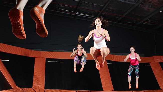 Stephen Parker takes Amanda Breen, Amy Van der Jagt and Amy Townsend through a trampoline aerobic class.