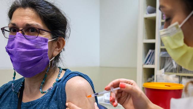 Covid-19 vaccines work by giving instructions to our body’s cells to manufacture the virus spike protein. Picture: AFP