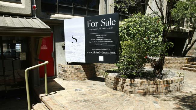 A for sale sign in the forecourt of the one of the building entrances. The Sirius Tower in The Rocks, 1 year after the last tenants were moved out of the Public housing tower. Picture: John Appleyard