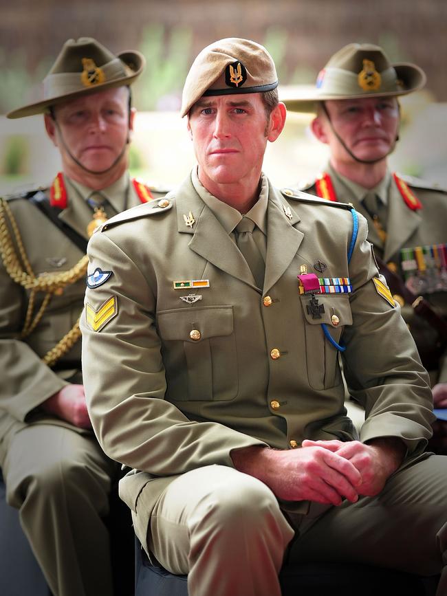 Australian Army soldier Corporal Benjamin Roberts-Smith, VC, MG, takes a seat after being awarded the Victoria Cross. Picture: Department of Defence