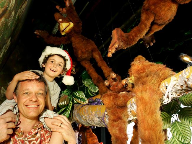 2007: Melbourne author Graeme Base takes Ben Bonnici on a tour of the Myer Christmas windows, based on his book, Uno’s Garden. Picture: News Limited