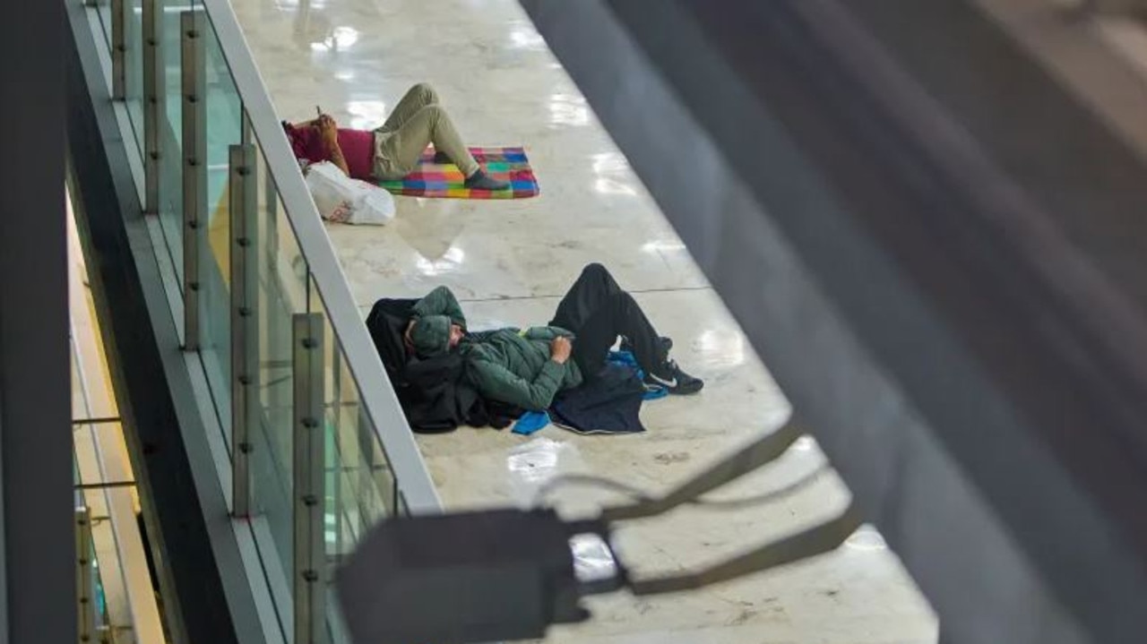 They can be found sleeping near restaurants, toilet entrances and on every level. Picture: AP