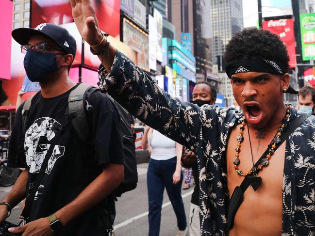 NEW YORK, NEW YORK - AUGUST 24: Protesters with the Black Lives Matter (BLM) movement march through Manhattan following the shooting of a Black man by a White police officer in Kenosha, Wisconsin over the weekend, on August 24, 2020 in New York City. The Wisconsin National Guard has been deployed to Kenosha after the man was shot several times at close range in the back during an encounter with a police officer, which was caught on video.   Spencer Platt/Getty Images/AFP == FOR NEWSPAPERS, INTERNET, TELCOS & TELEVISION USE ONLY ==