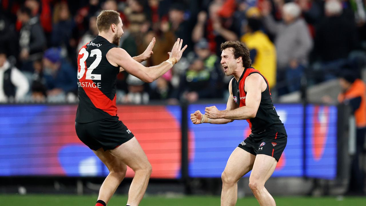 MELBOURNE, AUSTRALIA - JULY 05: Ben McKay (left) and Andrew McGrath of the Bombers celebrate during the 2024 AFL Round 17 match between the Collingwood Magpies and the Essendon Bombers at Melbourne Cricket Ground on July 05, 2024 in Melbourne, Australia. (Photo by Michael Willson/AFL Photos via Getty Images)