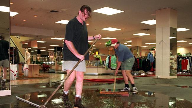 Workers begin the clean-up operation on the ground floor of Myer at Chermside shopping centre after storm damage in April 1997.