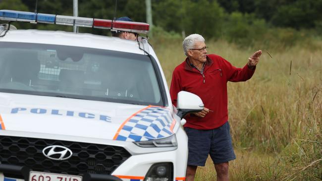 George Page, owner of the property where the plane crashed, speaks to police. Picture: Lachie Millard