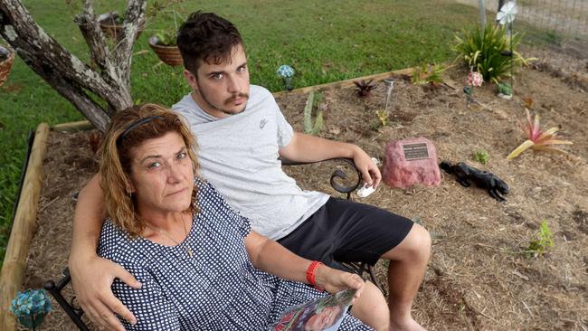 Anita Warburton, with son Riley, is still grieving her husband Michael who was killed when an allegedly stolen car driven by two teens hit him while riding his scooter at Hemmant. Photo: Steve Pohlner