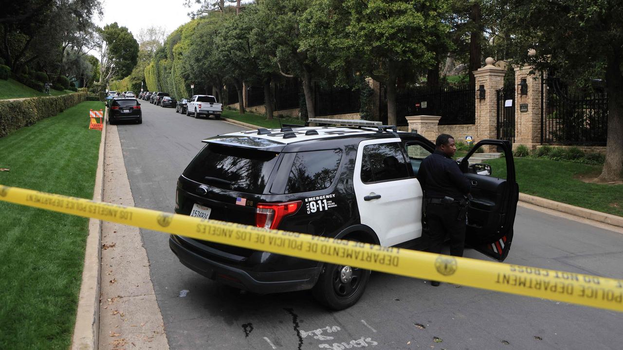 Police cars blocked off a street outside Diddy’s LA mansion in March after he was accused of racketeering and sex trafficking. Picture: David SWANSON / AFP