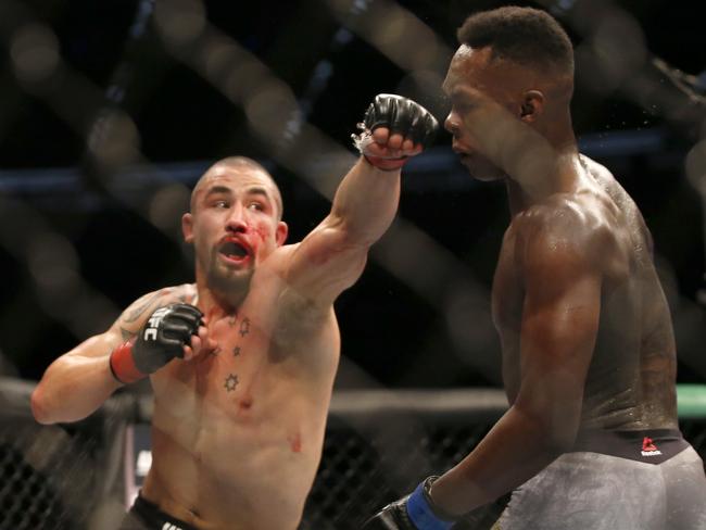 Israel Adesanya (R) first won the middleweight title by beating Rob Whittaker (R). Picture: Darrian Traynor/Getty Images