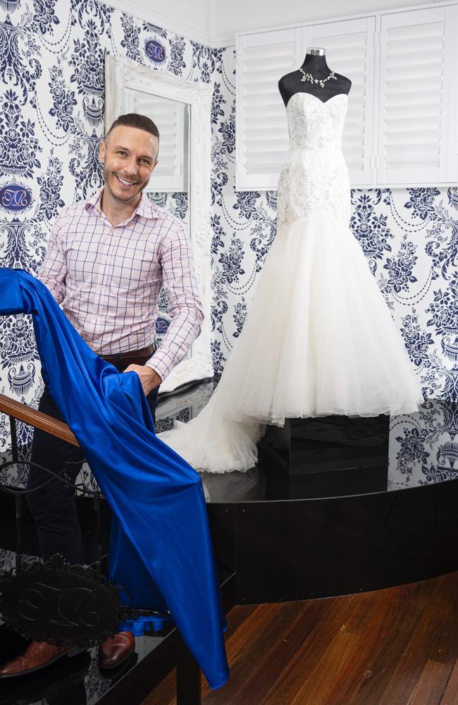 David Walker in the Touch of Romance Bridal and Formal showroom in Highfields with a showpiece Roz la Klein bridal gown on display in the background, Thursday, March 28, 2024. Picture: Kevin Farmer