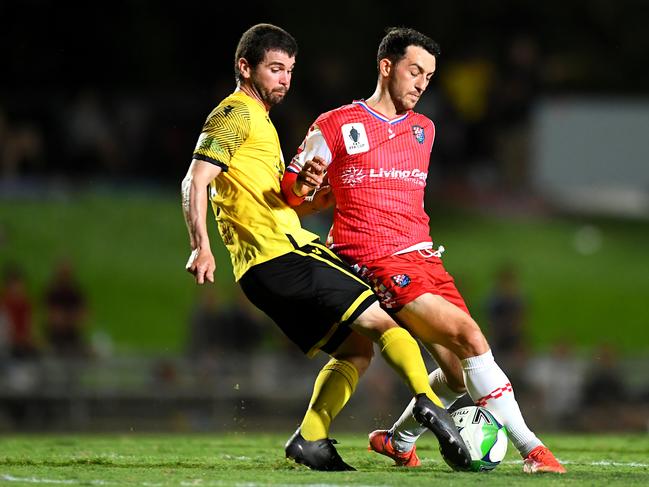 Josh De Nittis of Edge Hill United and Nicholas Panetta of the Knights compete for the ball during the FFA Cup round of 32 match between Edge Hill United and Gold Coast Knights at Barlow Park on September 15, 2021 in Cairns, Australia. (Photo by Albert Perez/Getty Images)