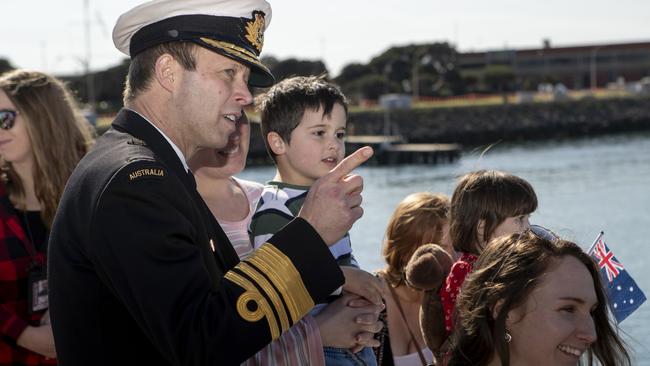 Vice Admiral Michael Noonan helps family members welcome home the Collins-class submarine HMAS Sheean to Fleet Base West in Perth. Picture: ADF