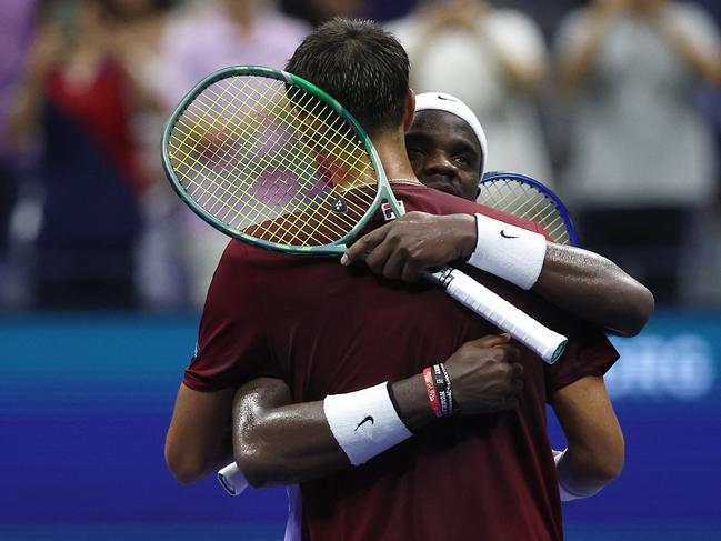 Frances Tiafoe hugs Alexei Popyrin. Photo: Matthew Stockman/Getty Images/AFP.