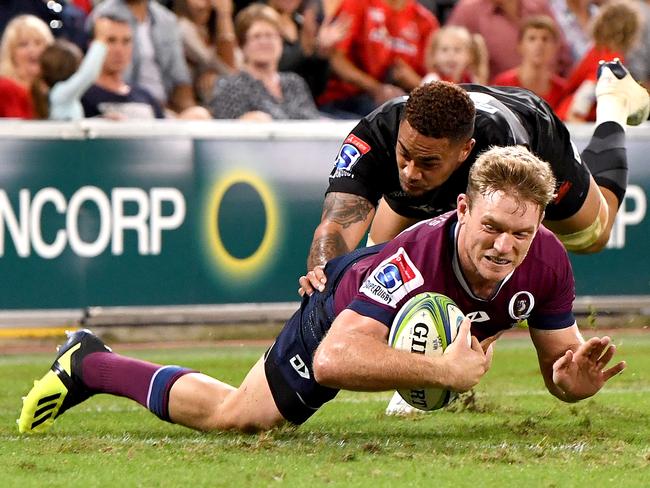 BRISBANE, AUSTRALIA - MAY 03: Bryce Hegarty of the Reds scores a try during the round 12 Super Rugby match between the Reds and the Sunwolves at Suncorp Stadium on May 03, 2019 in Brisbane, Australia. (Photo by Bradley Kanaris/Getty Images)