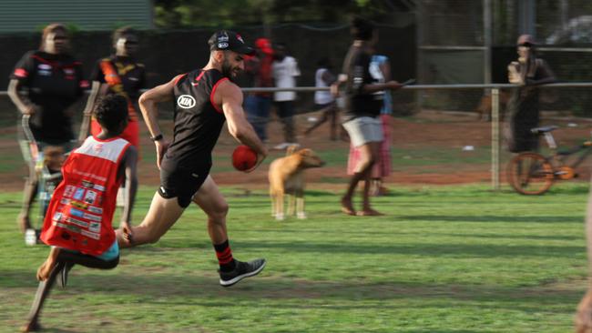 Adam Saad shows off his pace during Essendon’s visit to the Tiwi Islands. Picture: NATALIE MacGREGOR