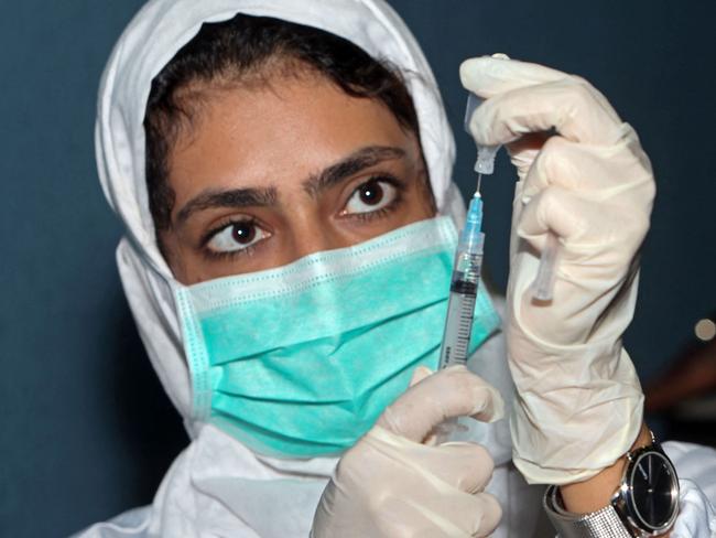 A medical worker prepares a dose of the Pfizer vaccine. Picture: AFP