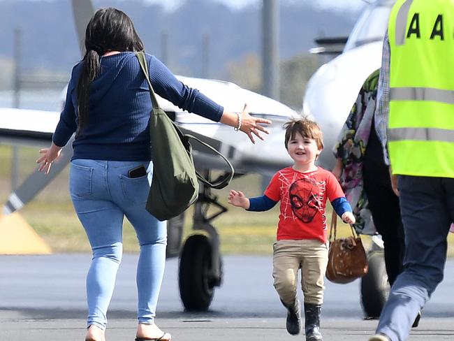 Memphis Francis has been reunited with his mother, Dominique Facer, at Archerfield airport in Brisbane. Picture: NCA NewsWire / Dan Peled