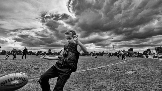 A budding football star sharpens his skills at the half-time break.