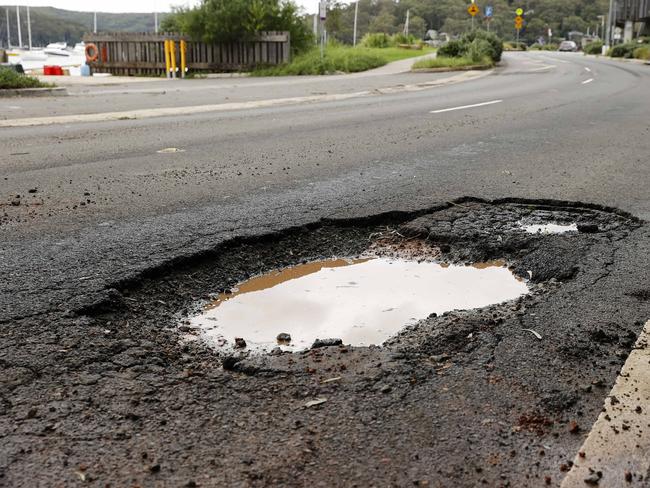 Massive new potholes popped up across the state after months of rain and flooding. Picture: Tim Hunter