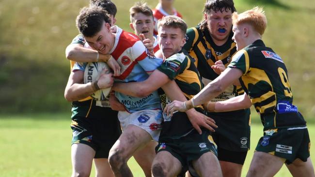 Sam England of the Milton-Ulladulla Bulldogs trying to bust a tackle. Photo: Contributed