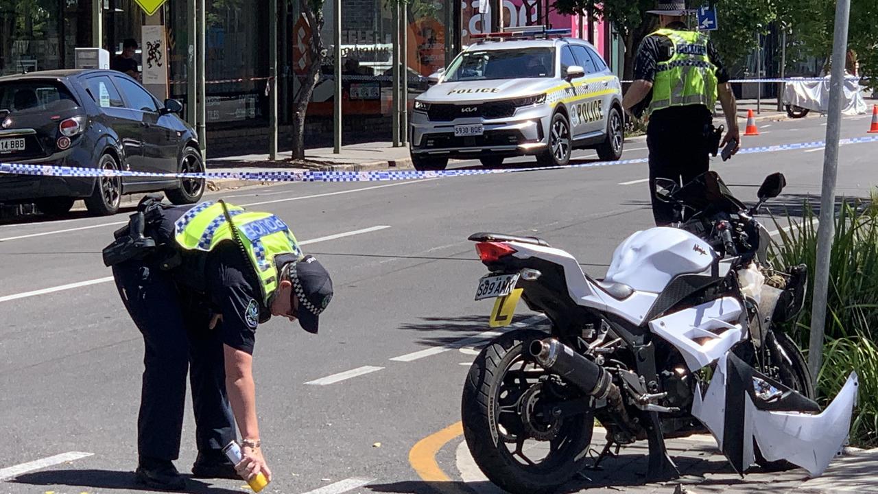 Police attend the scene of a serious crash between a motorcycle and a car in the Adelaide CBD on February 12, 2024. Picture: NCA NewsWire / Duncan Evans