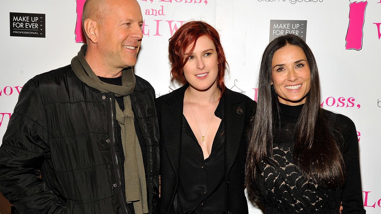 Exes, but still great friends: Bruce and Demi on a red carpet with daughter Rumer (centre).