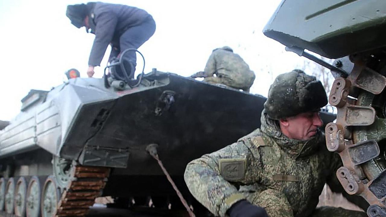 Russian servicemen preparing military vehicles to unload from a troop train for the joint drills in Belarus. Picture: MINISTRY OF DEFENCE REPUBLIC OF BELARUS / AFP.