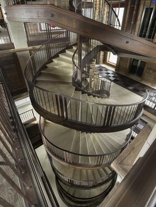 A magnificent spiral stairway provides access to all levels as well as a lift.