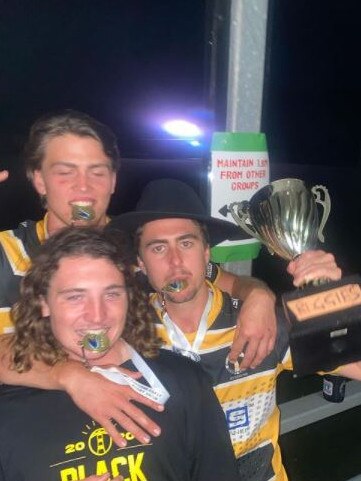 Caloundra Lighthouses reserve grade players Regan Nutley (back), Riley Waugh (middle) and Joseph Gordon (front), celebrate their 2020 premiership win. Picture: Regan Nutley Instagram