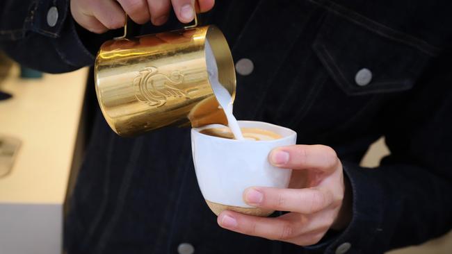 Difficult to resist … a barista prepares a milky latte. Picture: Jenifer Jagielski