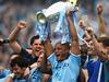 MANCHESTER, ENGLAND - MAY 11: Vincent Kompany of Manchester City lifts the Premier League trophy at the end of the Barclays Premier League match between Manchester City and West Ham United at the Etihad Stadium on May 11, 2014 in Manchester, England. (Photo by Shaun Botterill/Getty Images)