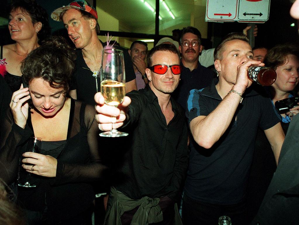 U2 band members, Bono and Larry Mullens, enjoy a drink at the 1998 Sydney Gay &amp; Lesbian Mardi Gras. Picture: Brad Newman