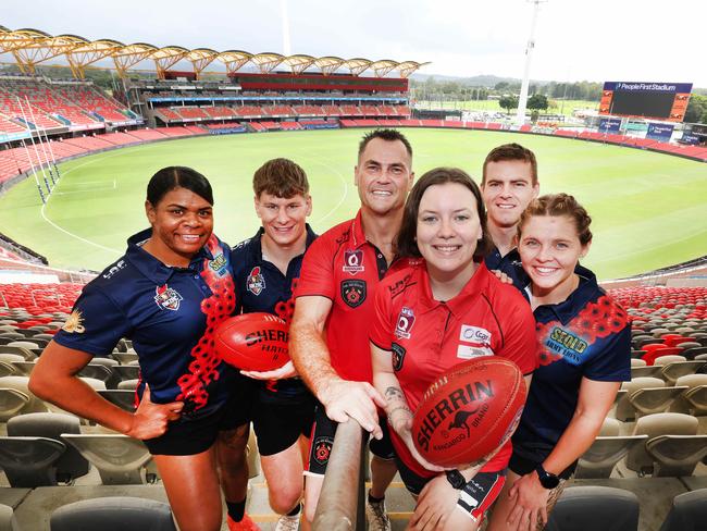 As part the Anzac Appeal Round game against Sydney on Sunday, the Gold coast Suns will be hosting two games between the QFES & Army at People First Stadium. Left to right,  Pamela Amber (Army) , Adam Dickenson (army), with Trev Butterfield and Kirra Braithwaite (Fire) and Jacob Raiston (Army) Mikayla Abson (army). Picture Glenn Hampson