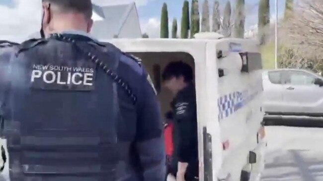 The two women were surrounded by supporters as they were arrested by police at the Organic Store on Saturday. Picture: Instagram