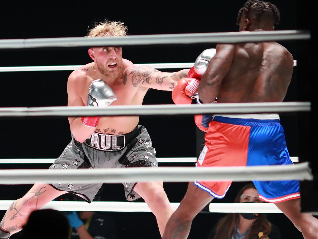 Jake Paul throws a punch against Nate Robinson.