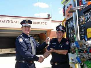 UPGRADE: North Burnett Area Commander Kent Freeman handing the keys of a new fire truck over to Gayndah Fire and Rescue Service Captain Ron Mitchell. Picture: Felicity Ripper