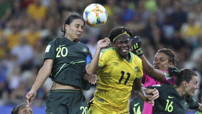 Australia’s Sam Kerr gets her head to the ball ahead of Jamaican opponents during the Matildas’ 4-1 victory yesterday. Picture: AP