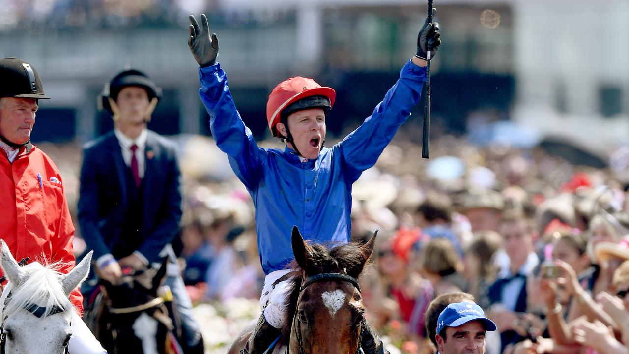 Jockey Kerrin McEvoy celebrates as he returns to the mounting yard after riding Cross Counter to victory in race 7 the Lexus Melbourne Cup, as part of the Melbourne Cup Carnival, at Flemington Racecourse in Melbourne, Tuesday, November 6, 2018. (AAP Image/Dan Himbrechts) NO ARCHIVING, EDITORIAL USE ONLY