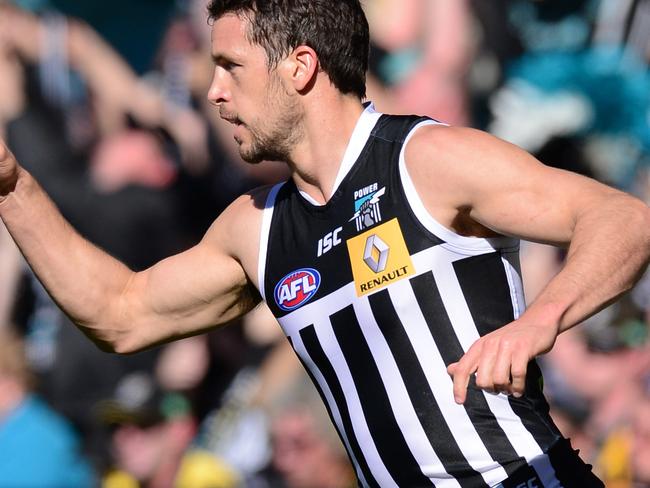 Port Adelaide’s Travis Boak celebrates a goal wearing the traditional prison bars jumper back in 2014. Picture: Mark Brake