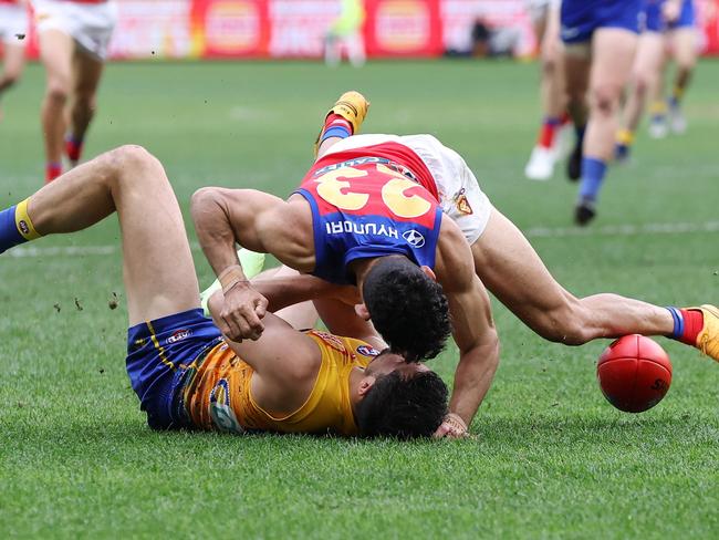 PERTH, AUSTRALIA - JULY 14: Liam Duggan of the Eagles is tackled by Charlie Cameron of the Lions during the 2024 AFL Round 18 match between the West Coast Eagles and the Brisbane Lions at Optus Stadium on July 14, 2024 in Perth, Australia. (Photo by Will Russell/AFL Photos via Getty Images)