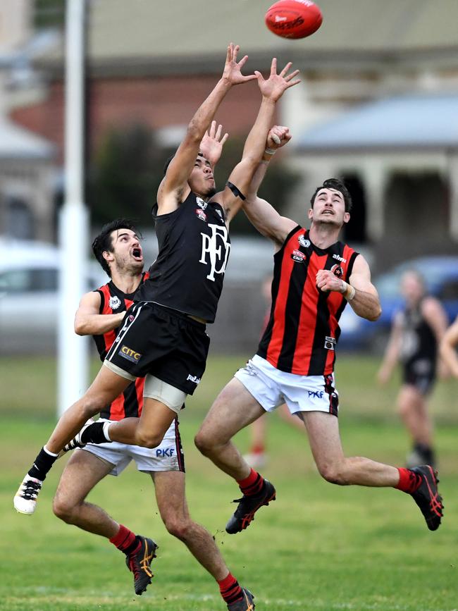 Kobe Broome (pictured flying for the mark) has joined SMOSH West Lakes from Port District. Picture AAP/Mark Brake.