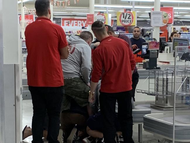 A man who allegedly struck a Coles employee with a stick in Brunswick was detained by staff and shoppers.