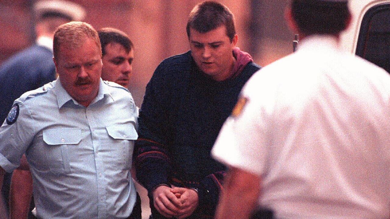 Frankston serial killer Paul Denyer being escorted by police in 1993.