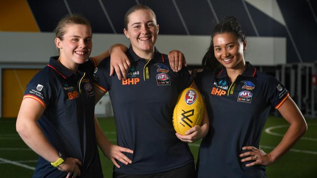 Chloe Scheer (left) with her new Crows teammates Katelyn Rosenzweig and Hannah Martin. Picture: Tricia Watkinson