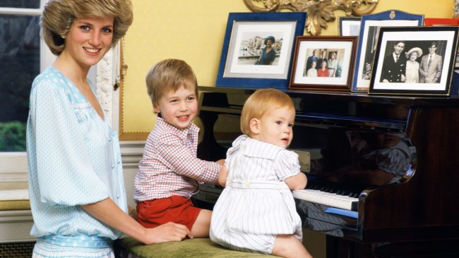 Diana, Princess of Wales, Prince William and Prince Harry, at the piano in Kensington Palace. Picture: Getty Images