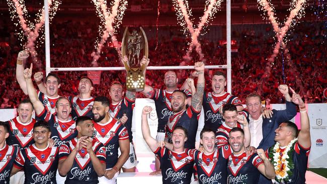 The Sydney Roosters celebrate with the Provan-Summons Trophy after defeating the Canberra Raiders in the 2019 NRL Grand Final at ANZ Stadium. Picture. Phil Hillyard