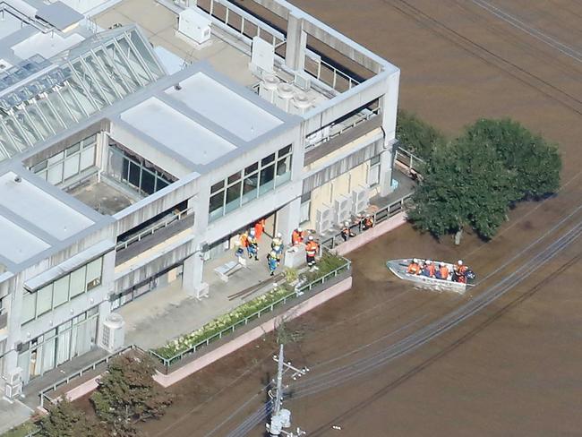 This aerial view shows rescue workers moving residents from the flooded Kawagoe Kings Garden nursing home. Picture: AFP/Japan OUT