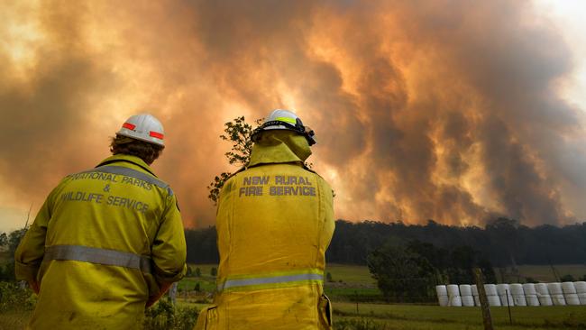 Smoke billows from the large bushfire outside Nana Glen. Picture: AAP