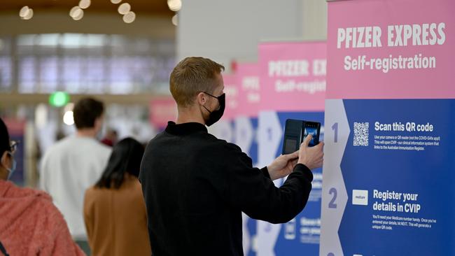 The new norm: A man checks in at The Wayville Vaccine hub. Picture: NCA NewsWire / Naomi Jellicoe